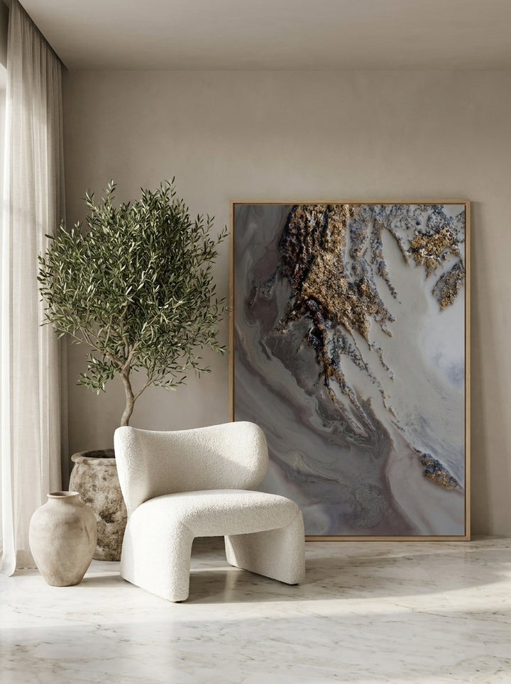 Oversized statement modern wall art print leaning against the wall in a luxe dining room