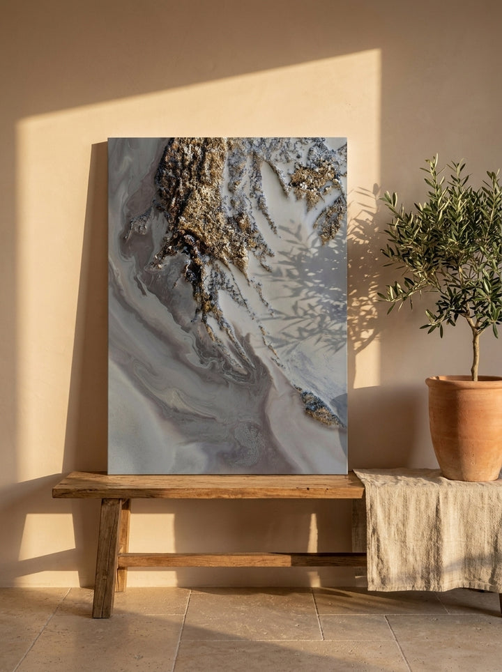 Stretched canvas wall art standing on a bench in a Mediterranean home office