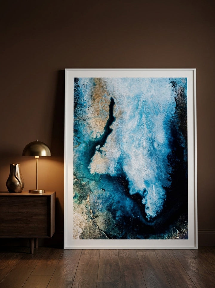 Oversized statement modern wall art print leaning against the wall in a moody dining room