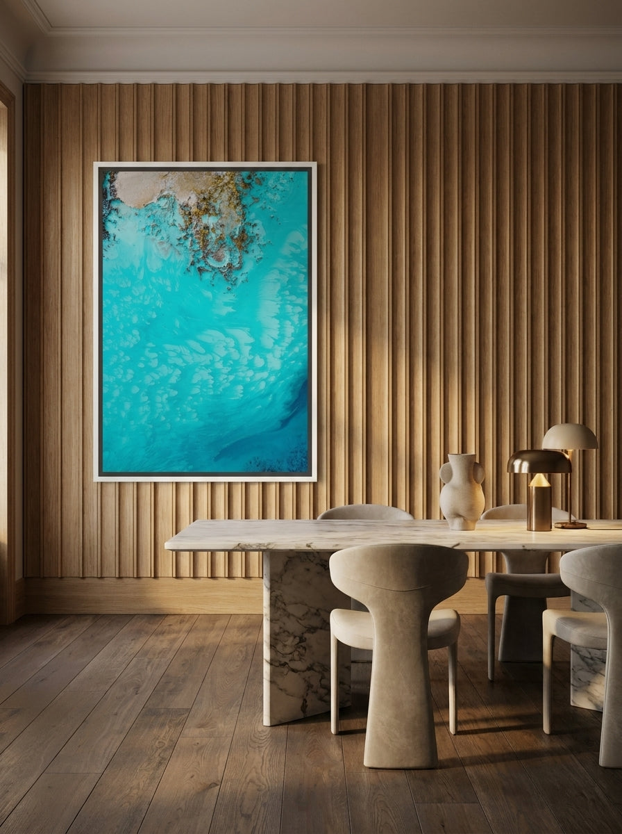 Oversized statement canvas wall art with a white surround styled on the wall in a luxe dining room