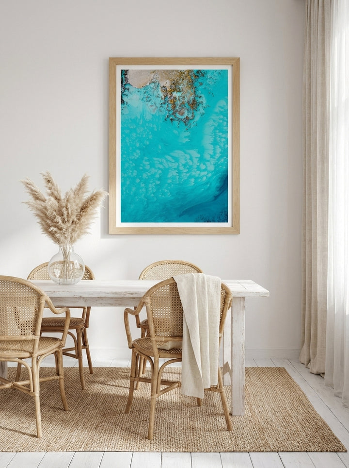 Modern wall art print styled on the wall in a coastal dining room