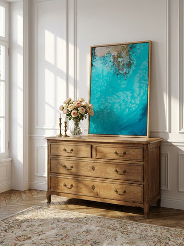 Canvas wall art with a natural timber surround standing on a sideboard in a Parisian bathroom