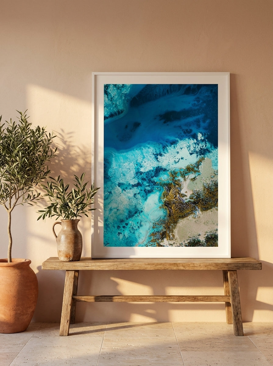 Modern wall art print standing on a bench in a Mediterranean bedroom
