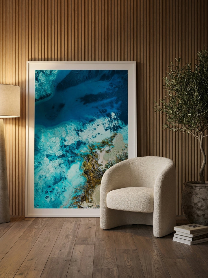 Oversized statement modern wall art print leaning against the wall in a luxe dining room