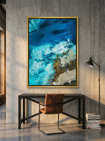 Canvas wall art with a gold leaf surround styled on the wall in an industrial loft home office