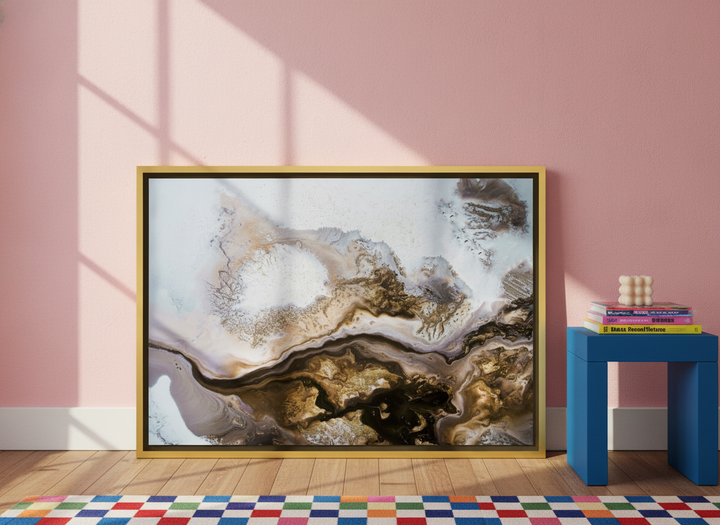 Canvas wall art with a gold leaf surround leaning against the wall in a colourful eclectic living room