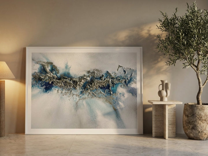 Oversized statement modern wall art print leaning against the wall in a luxe living room
