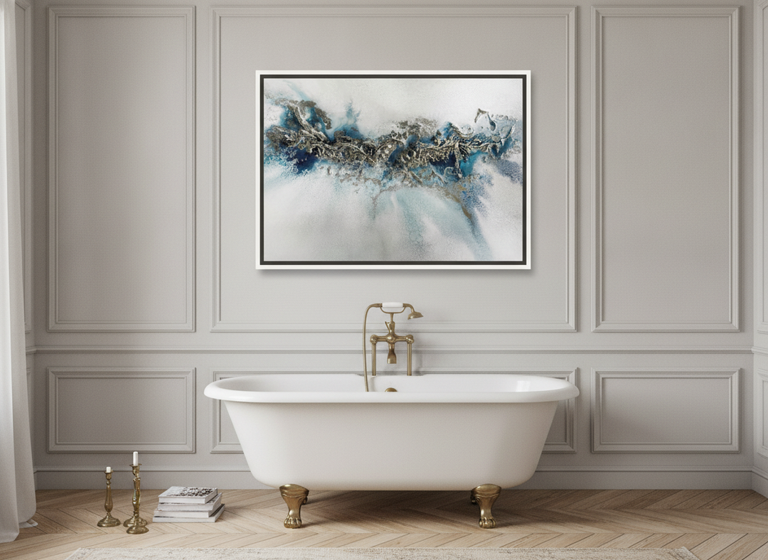 Canvas wall art with a white surround styled on the wall in a Parisian bathroom