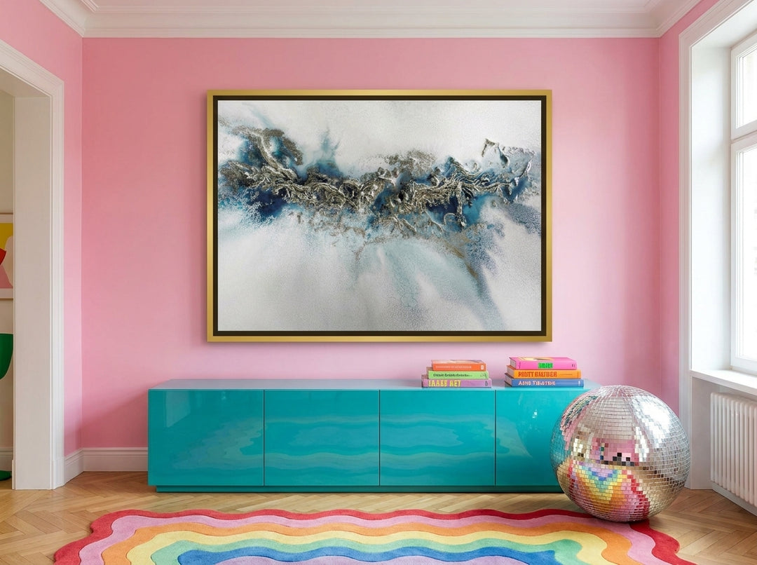 Oversized statement canvas wall art with a gold leaf surround styled on the wall in a colourful eclectic living room