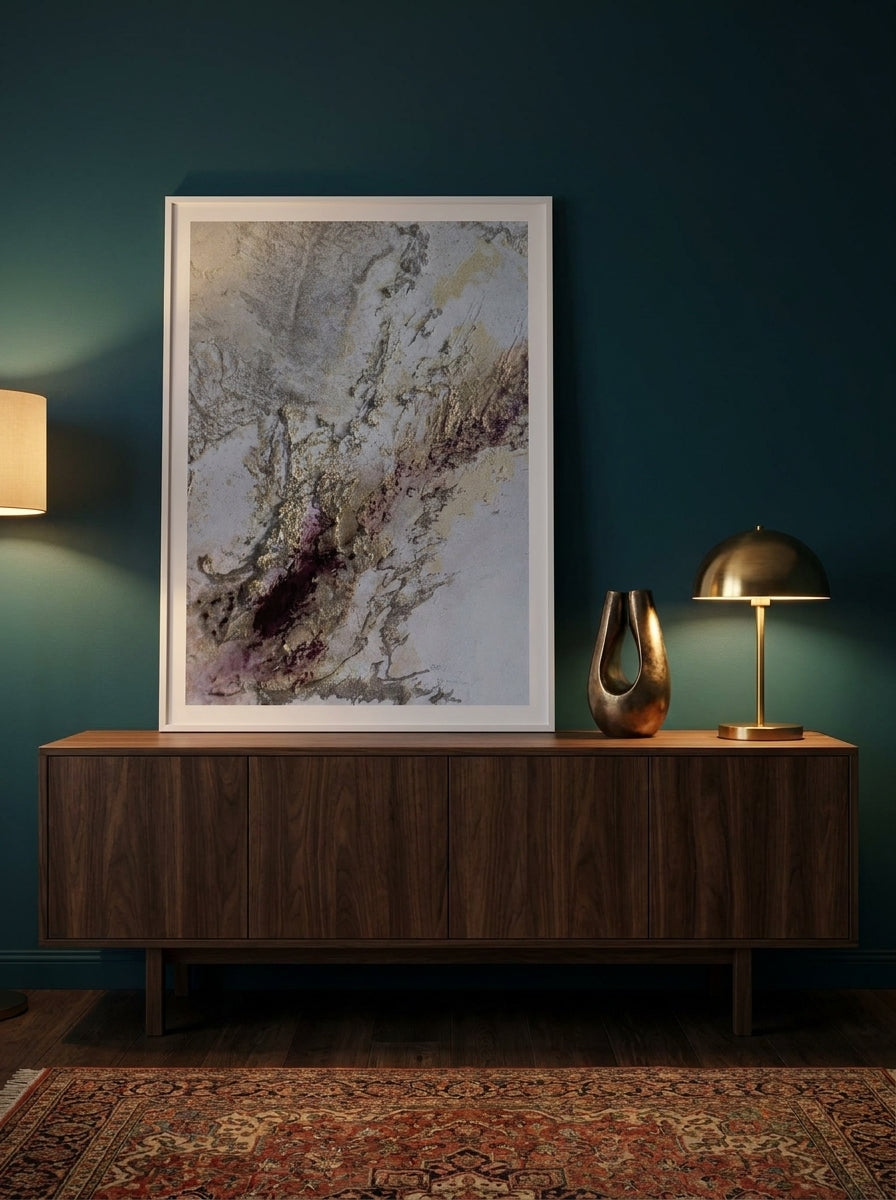Modern wall art print standing on a sideboard in a moody bedroom