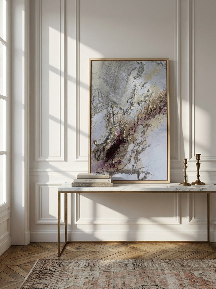 Canvas wall art with a natural timber surround standing on a console in a Parisian bedroom
