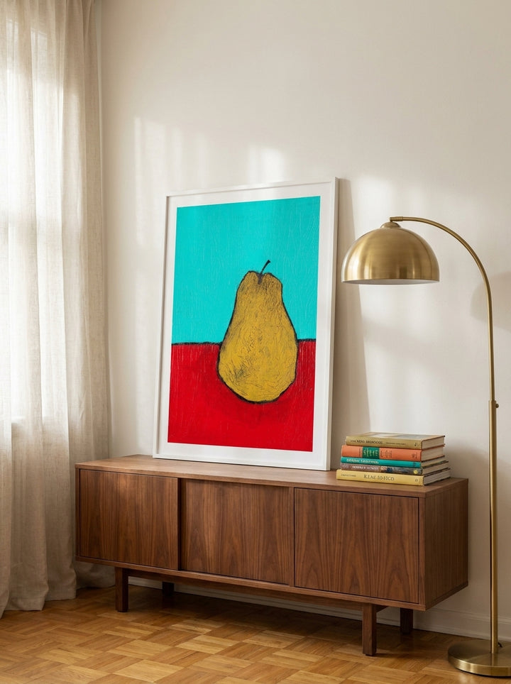 Modern wall art print standing on a sideboard in a mid-century living room
