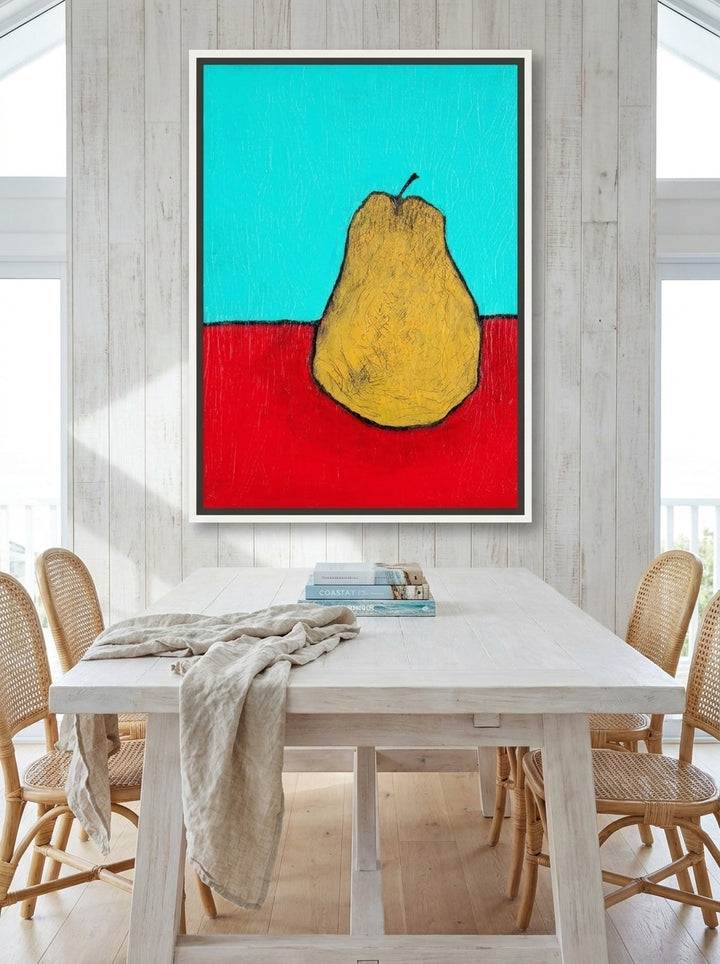 Oversized statement canvas wall art with a white surround styled on the wall in a coastal dining room