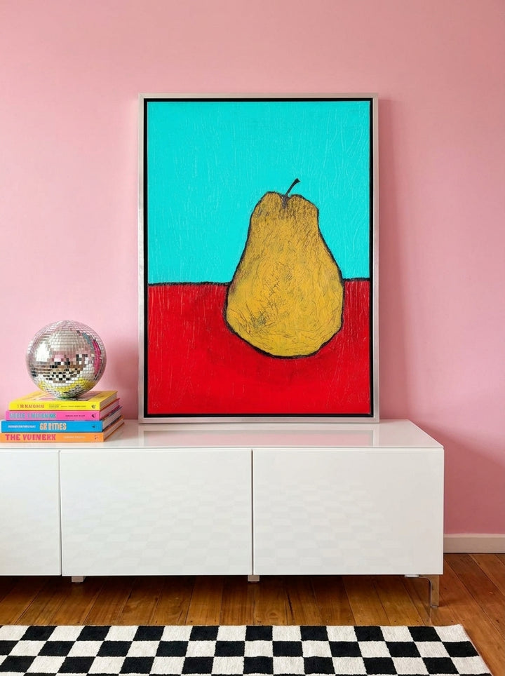 Canvas wall art with a silver leaf surround standing on a sideboard in a colourful eclectic dining room