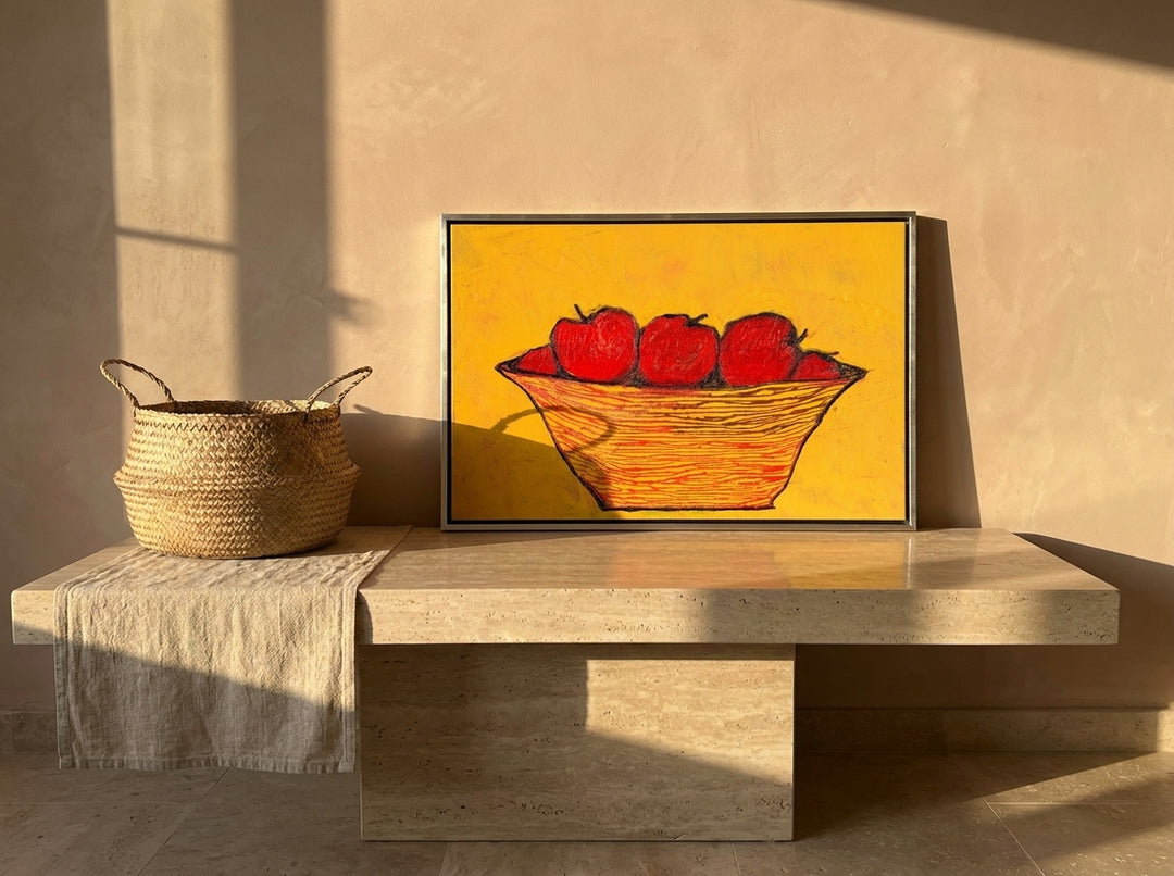 Canvas wall art with a silver leaf surround standing on a console in a Mediterranean living room