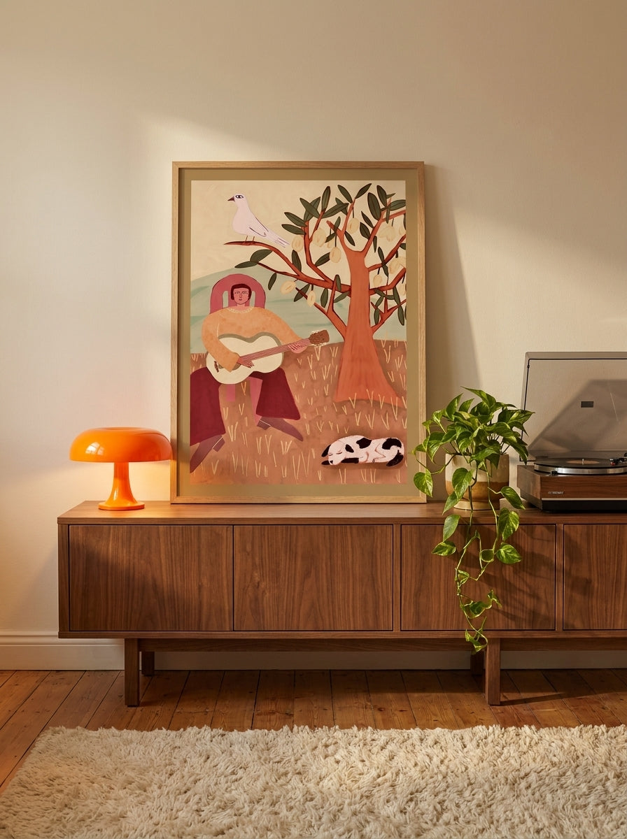 Modern wall art print standing on a sideboard in a retro 70s home office