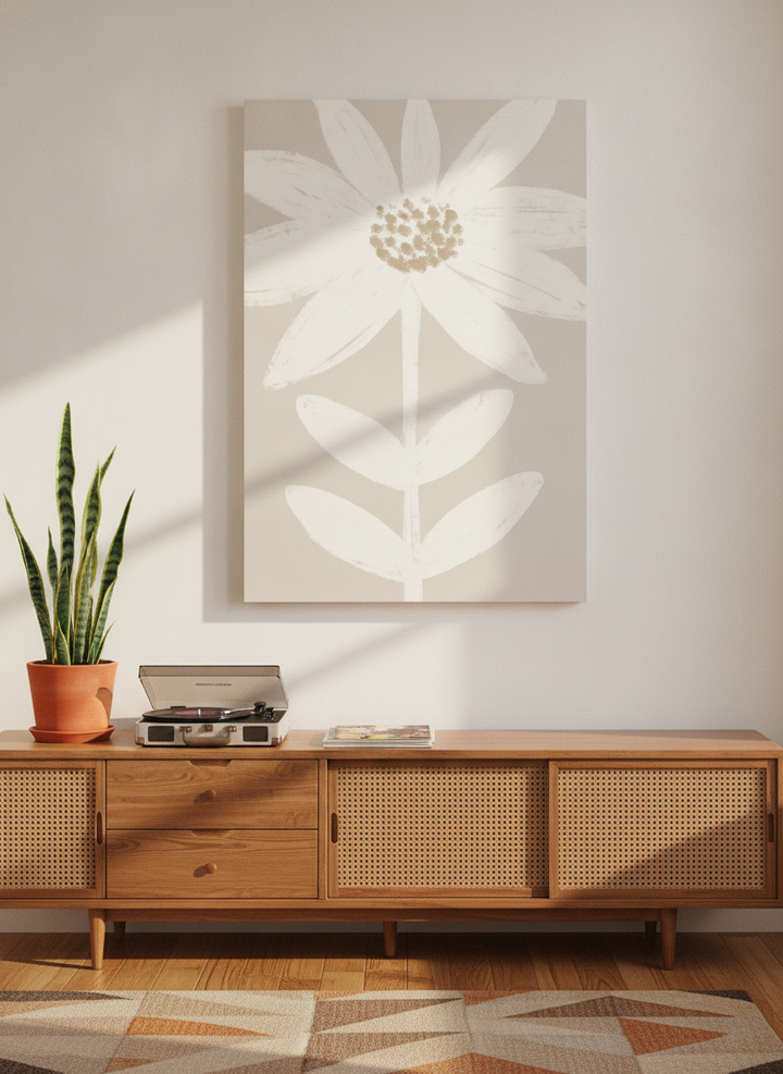 Stretched canvas wall art standing on a sideboard in a mid-century bedroom