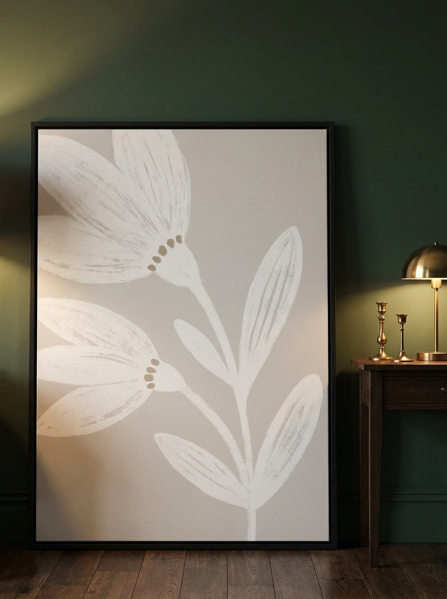 Oversized statement canvas wall art with a black surround leaning against the wall in a moody dining room