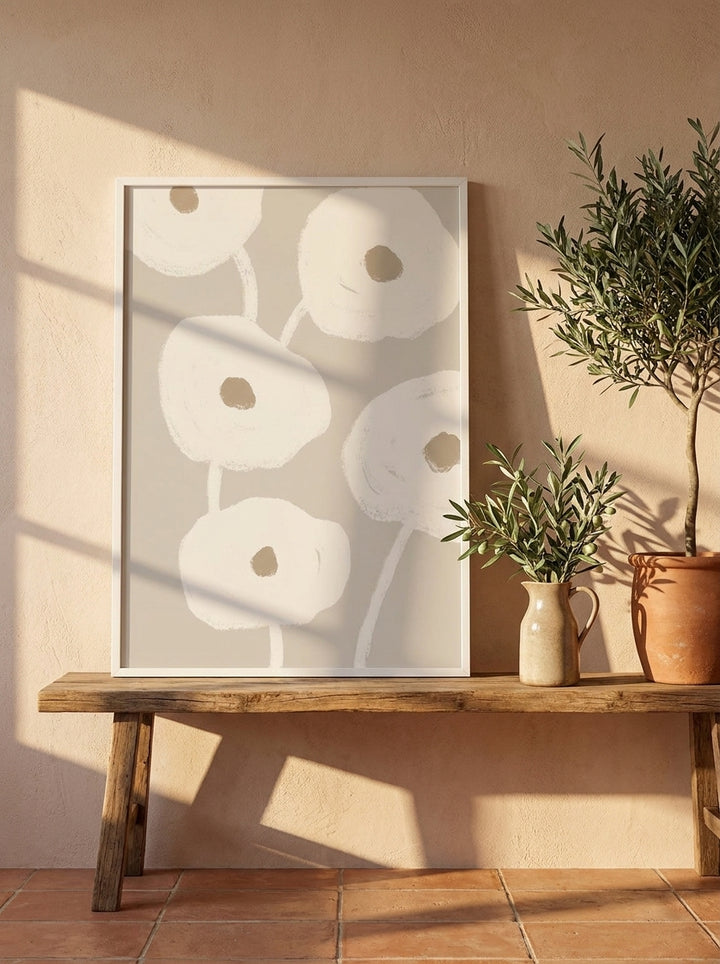 Modern wall art print standing on a bench in a Mediterranean bathroom