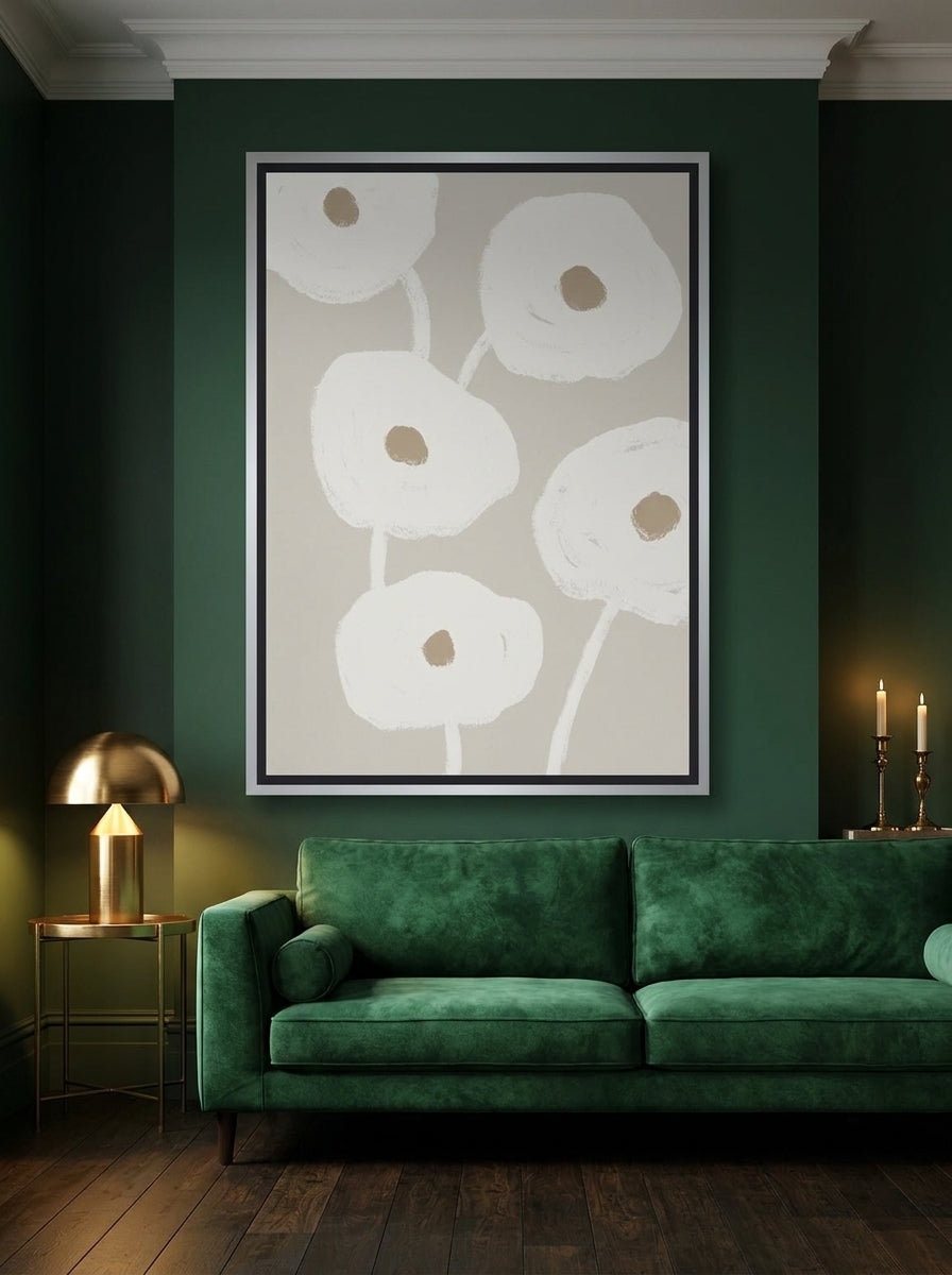 Oversized statement canvas wall art with a silver leaf surround styled on the wall in a moody living room
