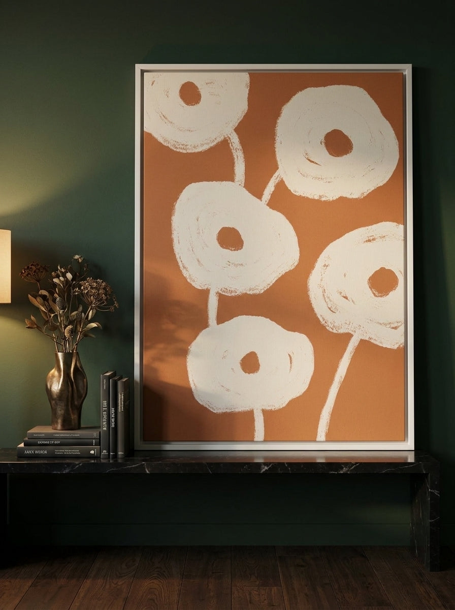 Canvas wall art with a white surround standing on a kitchen bench in a moody kitchen
