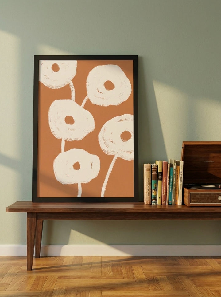 Modern wall art print standing on a kitchen bench in a mid-century kitchen