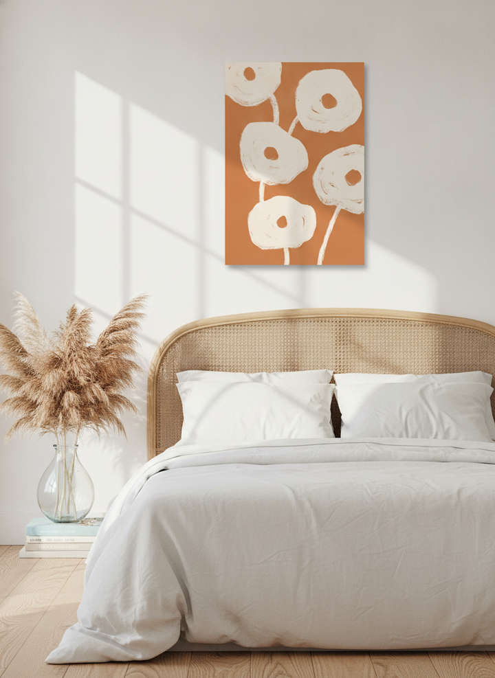 Stretched canvas wall art styled on the wall in a coastal bedroom