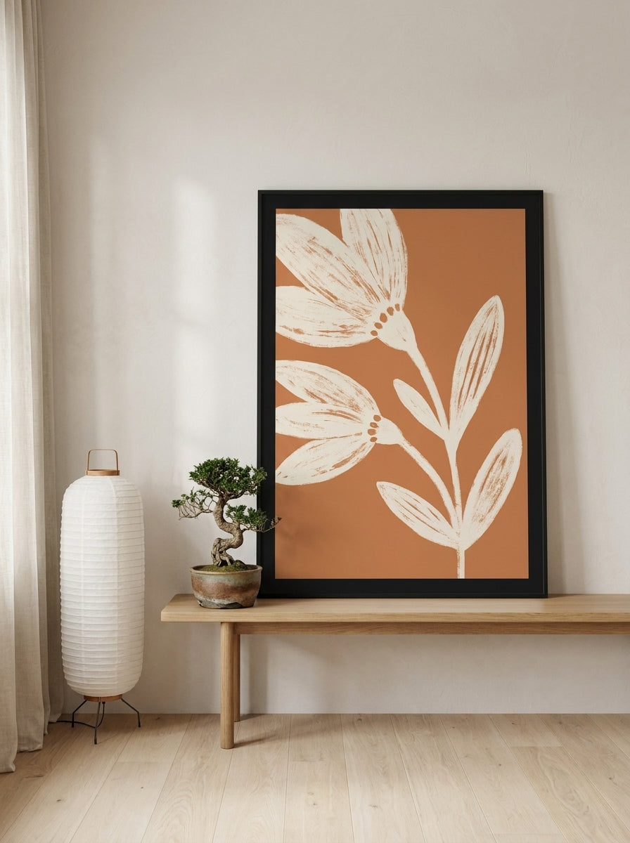 Modern wall art print standing on a bench in a warm Japandi bedroom
