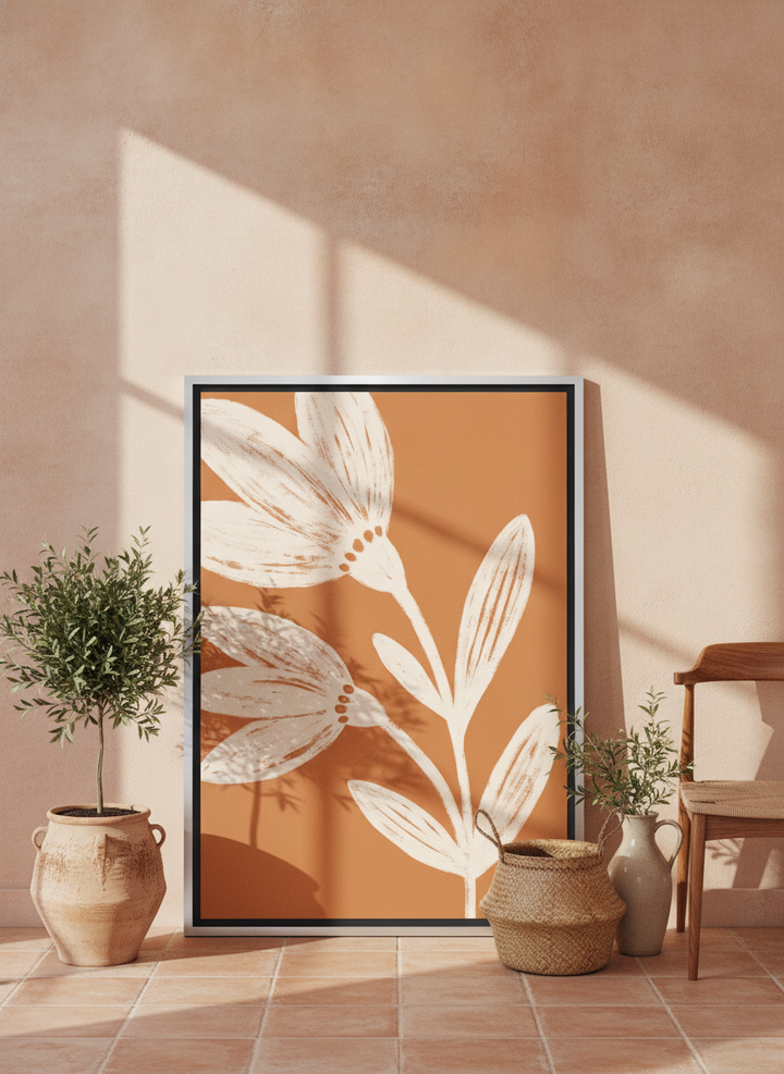 Canvas wall art with a silver leaf surround leaning against the wall in a Mediterranean bedroom