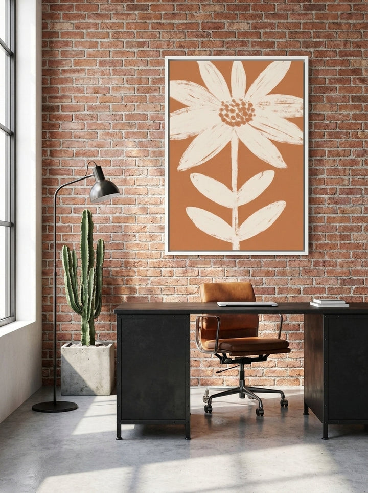 Canvas wall art with a white surround styled on the wall in an industrial loft home office