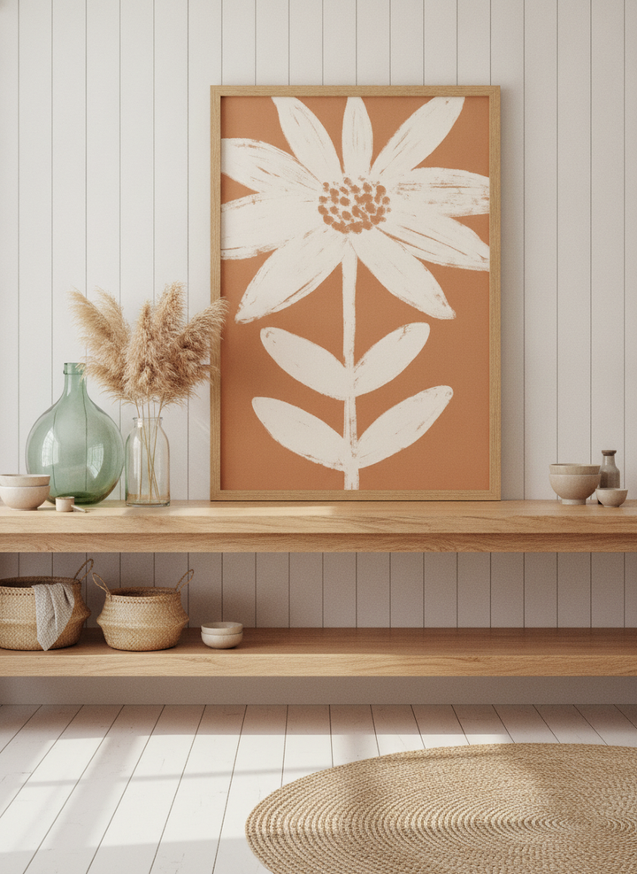 Modern wall art print standing on a kitchen bench in a coastal kitchen