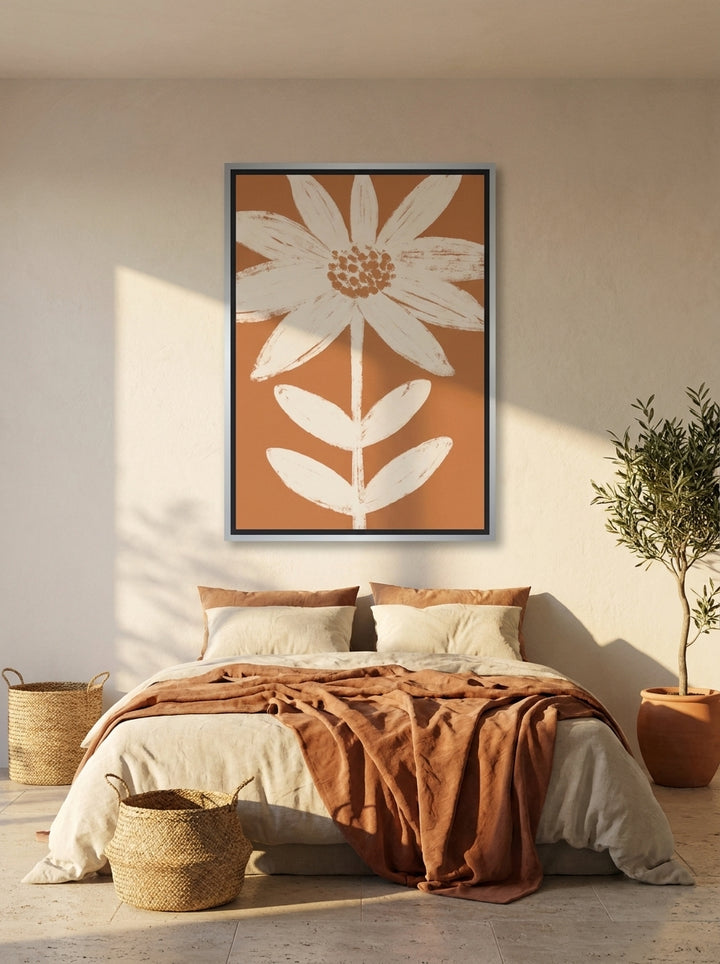 Canvas wall art with a silver leaf surround styled on the wall in a Mediterranean bedroom