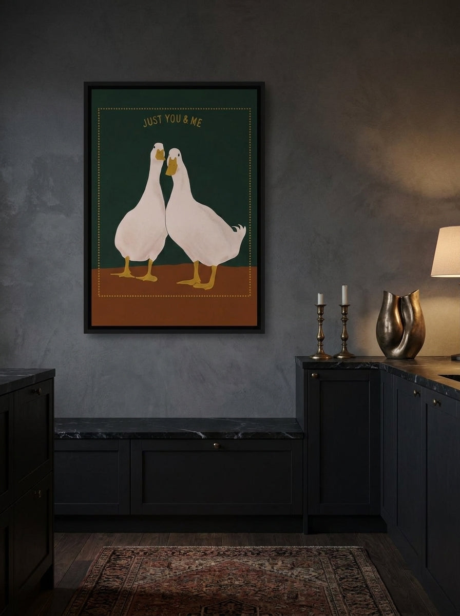 Canvas wall art with a black surround styled on the wall in a moody kitchen