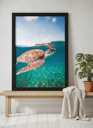 Modern wall art print standing on a bench in a bright Scandinavian bathroom