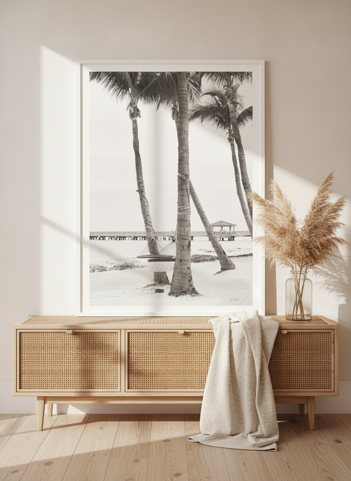 Modern wall art print standing on a sideboard in a coastal living room
