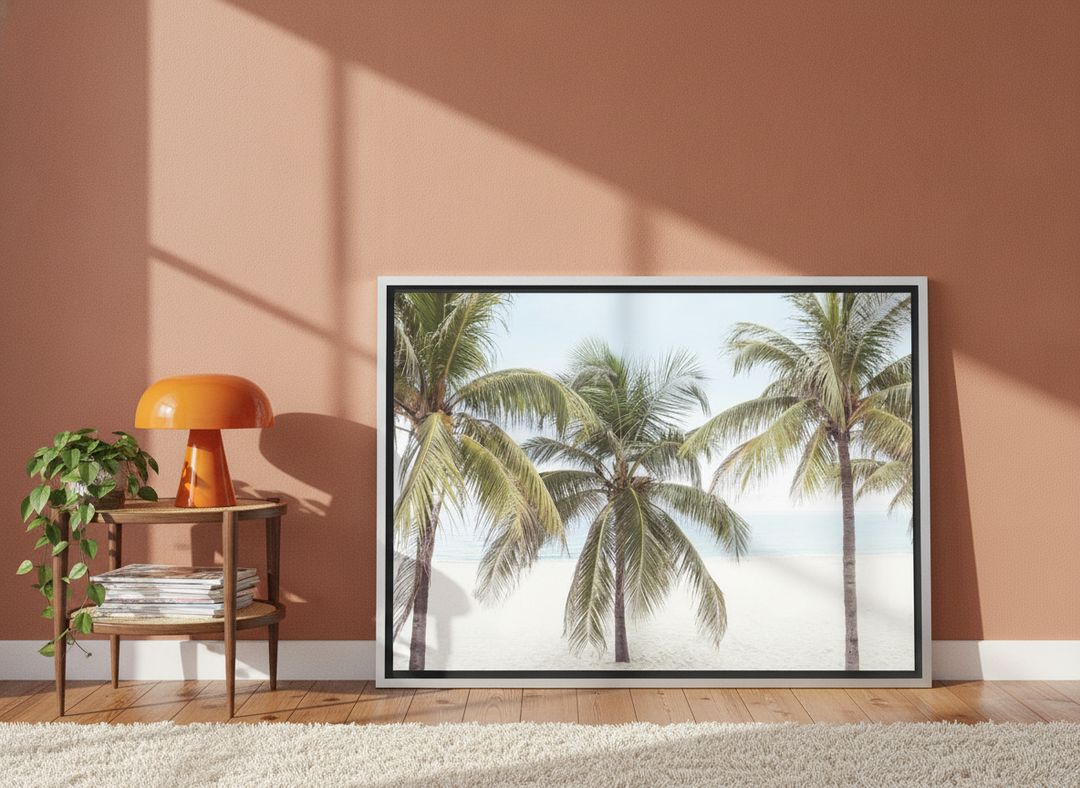 Canvas wall art with a silver leaf surround leaning against the wall in a retro 70s home office