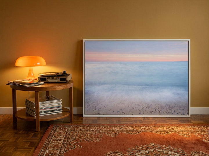 Canvas wall art with a white surround leaning against the wall in a retro 70s home office