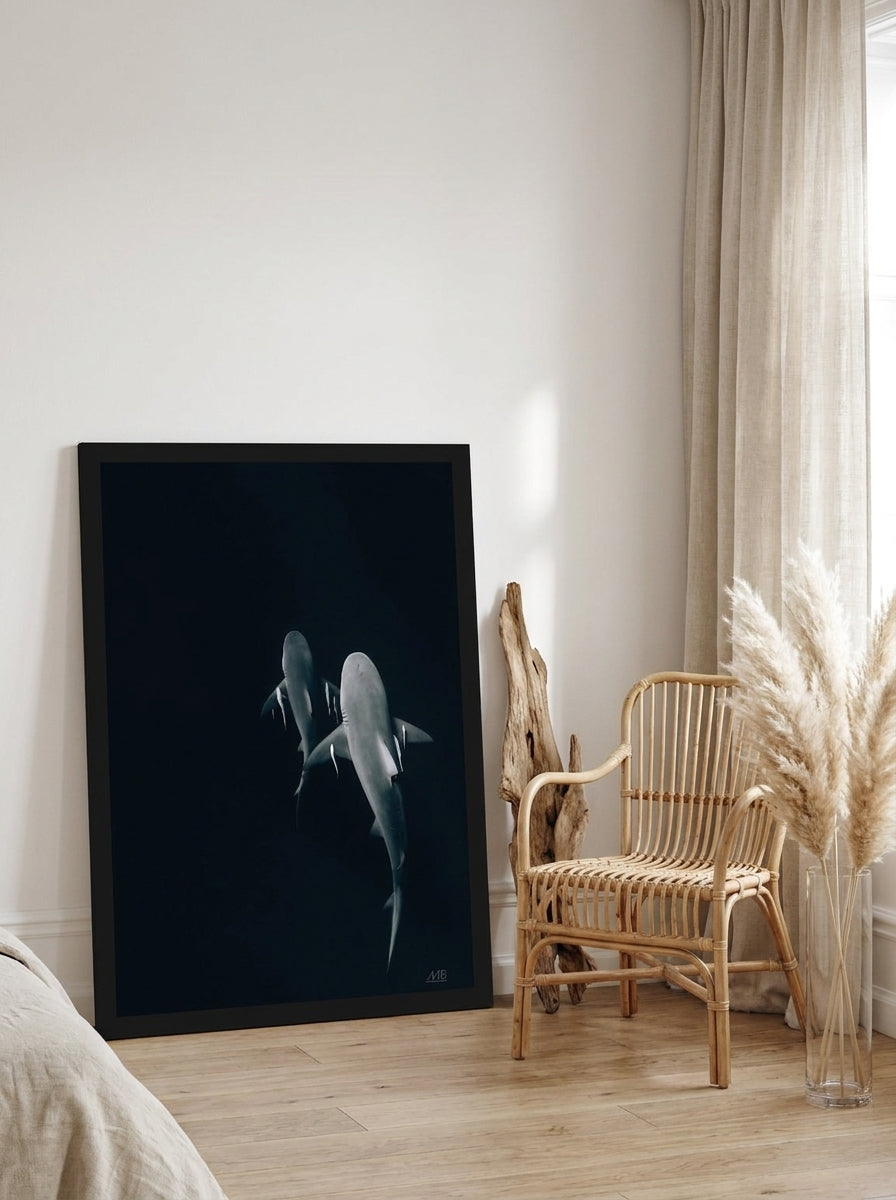 Modern wall art print leaning against the wall in a coastal bedroom