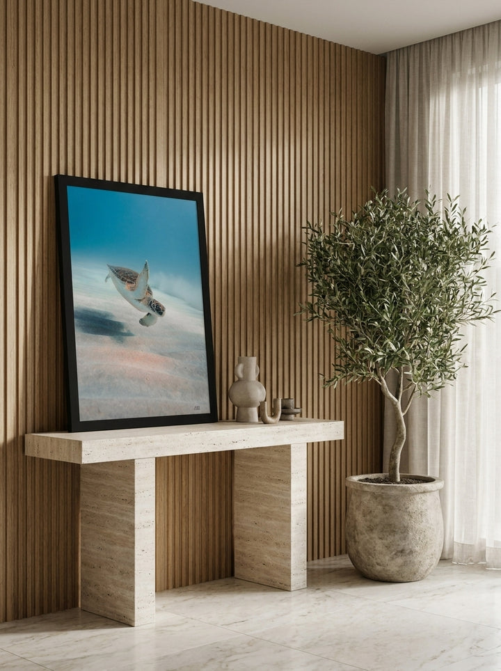 Modern wall art print standing on a console in a luxe home office