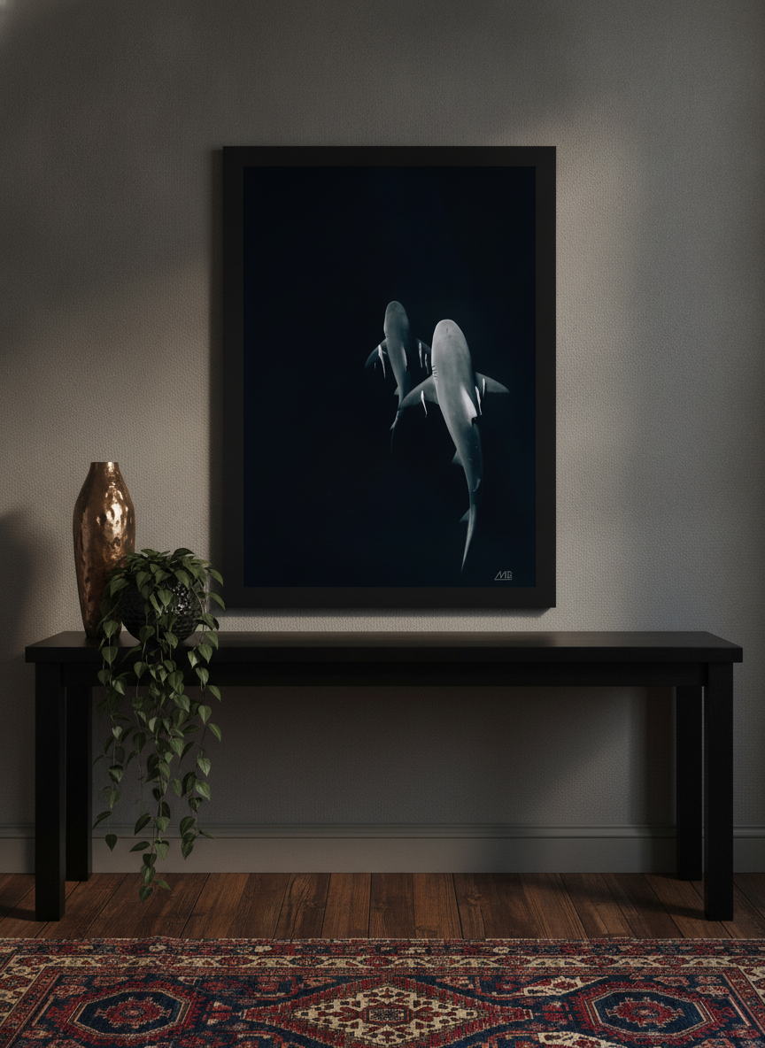 Modern wall art print standing on a console in a moody home office