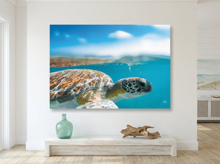 Stretched canvas wall art styled on the wall in a coastal living room