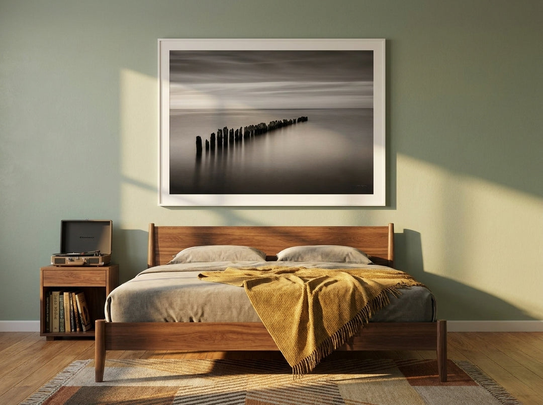 Modern wall art print styled on the wall in a mid-century bedroom