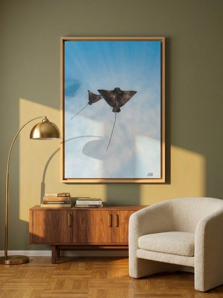 Oversized statement canvas wall art with a natural timber surround styled on the wall in a mid-century living room