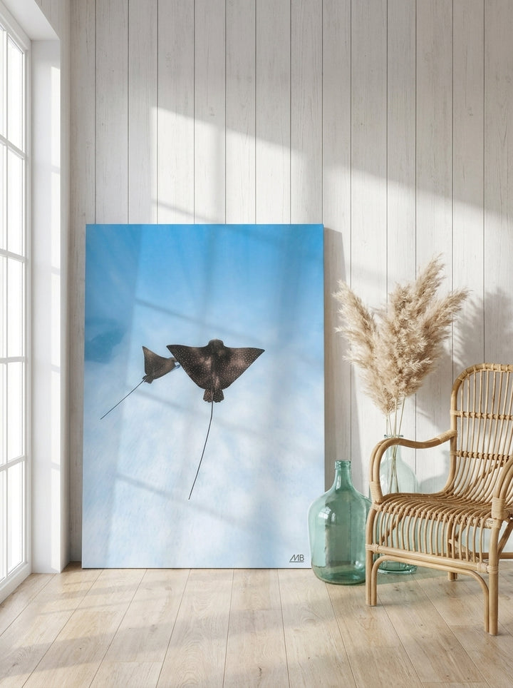Stretched canvas wall art leaning against the wall in a coastal dining room
