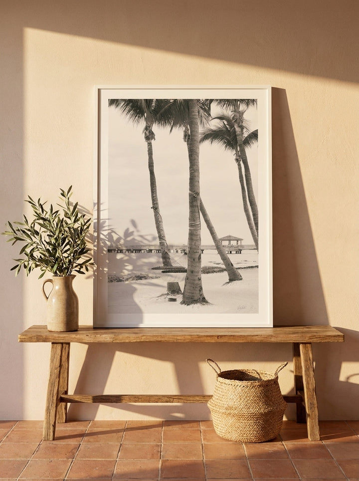 Modern wall art print standing on a bench in a Mediterranean bedroom