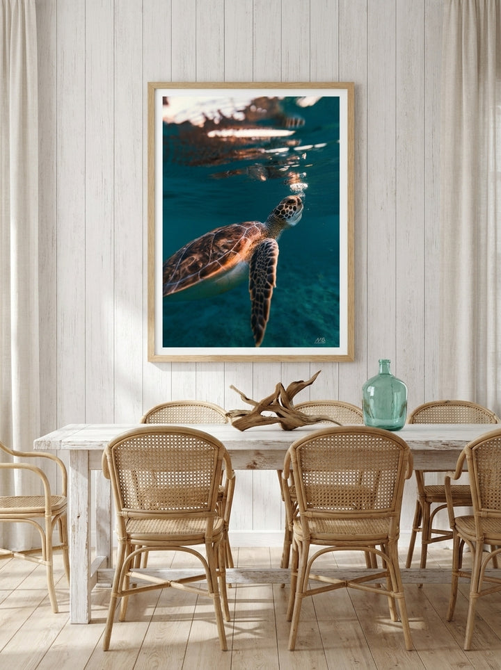 Modern wall art print styled on the wall in a coastal dining room