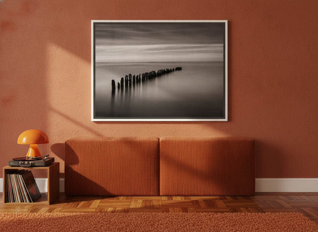 Canvas wall art with a white surround styled on the wall in a retro 70s bedroom