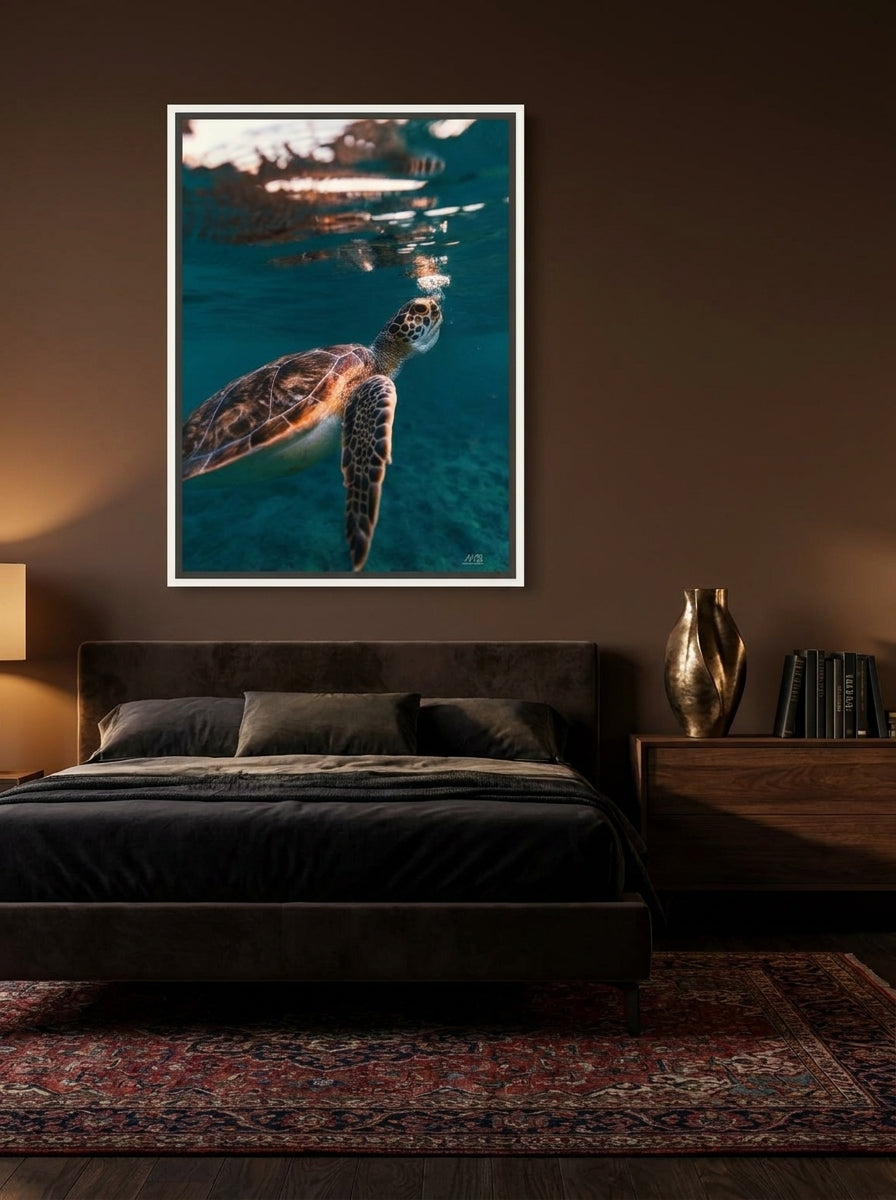 Canvas wall art with a white surround styled on the wall in a moody bedroom