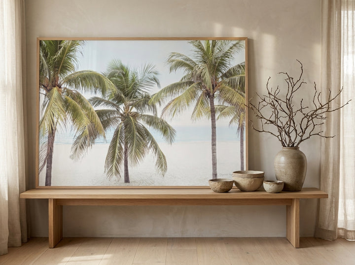 Modern wall art print standing on a bench in a warm Japandi bathroom