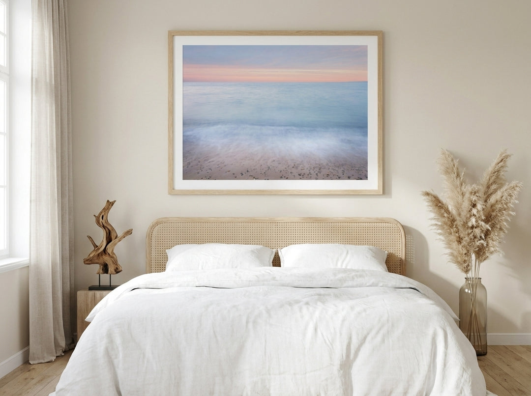 Modern wall art print styled on the wall in a coastal bedroom